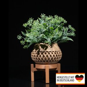 Eleganter Pflanztopf mit Gestell im Wohnzimmer